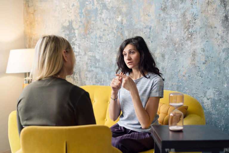 Addiction counselor speaking to patient